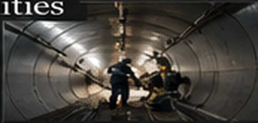 Technician servicing industrial tank valves and piping
